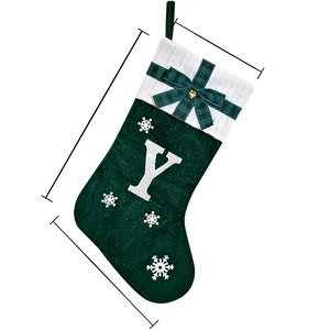 Green personalized Christmas stocking with white knit cuff, embroidered letter Y and bells