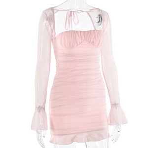 Close-up of pink sequin bodycon dress featuring mesh sleeves and ruffle cuff details