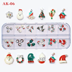 Detailed close-up of 48-piece Christmas alloy nail charms with rhinestones in a storage box