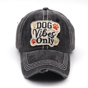 Close-up of vintage washed grey cotton baseball cap with DOG Vibes Only patch embroidery