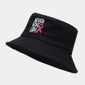Detail of Never Give Up text and pink ribbon embroidery on black cotton bucket hat