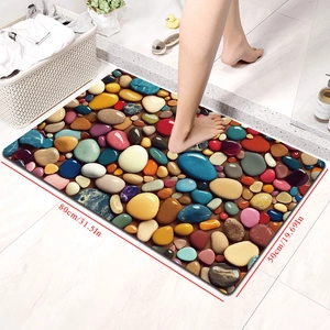 Detail view of 3D pebble pattern bath mat showing 80x50cm dimensions on tiled floor