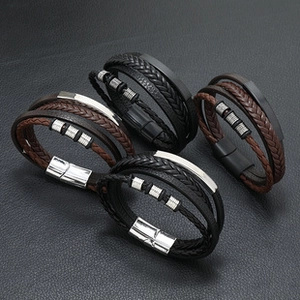 Detail of multi-layer braided leather bracelets for men with alloy magnetic clasps