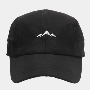 Close-up of a black five-panel quick-dry baseball cap with white mountain embroidery