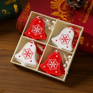 Close-up of wooden Christmas bell ornaments with snowflakes in a decorative gift box