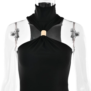 Detailed front view of black halter dress with gold metal ring neck decoration