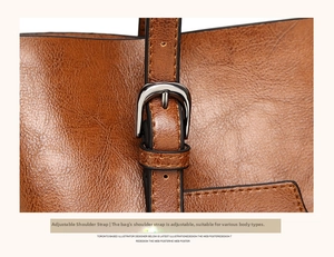 Detail shot of the adjustable leather shoulder strap with durable silver metal buckle
