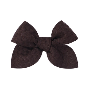 Detail shot of the coffee brown waffle knit texture on this 3.3-inch hair bow clip