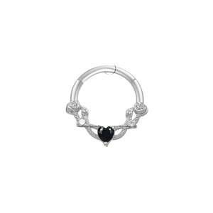Silver nose ring with a black heart gem and floral engraving on a white background
