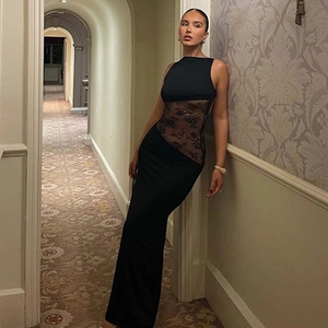 Detail of elegant black sleeveless long dress with sheer lace waist paneling