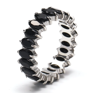 Detail of silver eternity band featuring marquise-cut black stones in a prong setting
