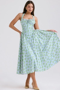 Detail of blue floral halter neck dress with front drawstring and ruffle trim design
