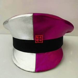 Close-up of a two-tone peaked cap with silver and magenta panels and black decorative band