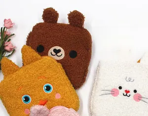 Detail of plush animal sanitary pouch showing soft texture and cute embroidery