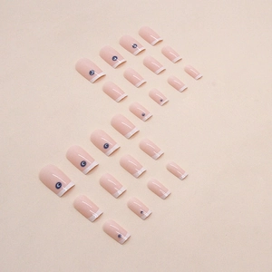 French tip press-on nails with blue evil eye design in 24-piece short square set