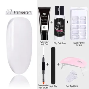 Detail view of solid extension nail gel kit with UV lamp and professional tools