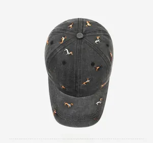 Top view of vintage washed grey baseball cap with colorful dachshund puppy embroidery
