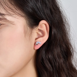 Close-up of S925 sterling silver rainbow earring with gradient zircon stones on a model