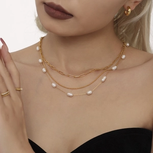 Three-layer gold paperclip and bead chain necklace with white baroque pearls