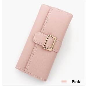 Detail shot of the pink lychee leather texture and golden metal buckle on women's long wallet