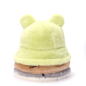 Stack of fuzzy teddy bear bucket hats in green, brown, gray and white plush fabric
