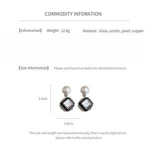 Detail view of cube pearl earrings with dimensions and material specifications