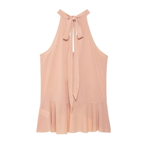 Close-up of pink halter neck top featuring elegant bow tie and ruffled hemline