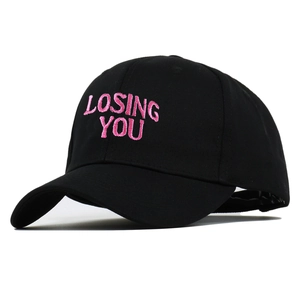 Black baseball cap with pink LOSING YOU embroidery in a classic curved brim style