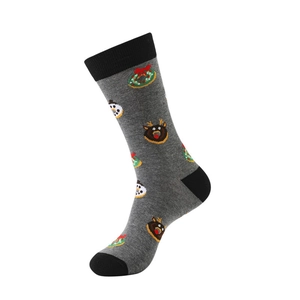 Close-up of knit Christmas crew socks featuring reindeer and snowman patterns on grey fabric