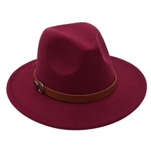 Detail of burgundy wool fedora hat featuring a brown leather band and silver buckle