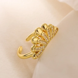 Elegant 18K gold-plated geometric fan-shaped ring with zircon stones on beige fabric