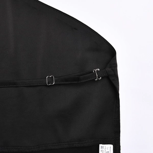 Detail of adjustable metal strap buckle and size label on black satin fabric set