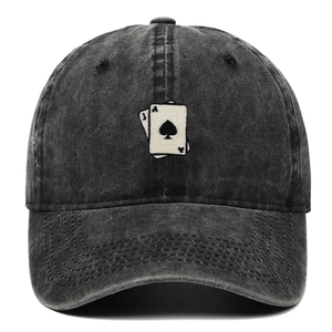 Detail of vintage washed black denim baseball cap with playing card embroidery motif