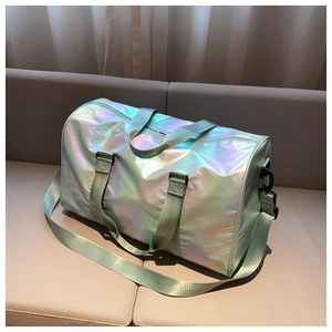Detailed close-up of a holographic travel bag with a gradient green and pink finish