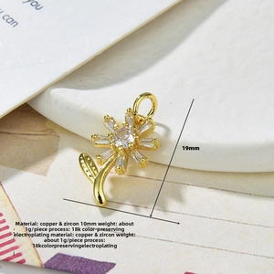 Detail of 18k gold plated sunflower pendant showing copper and zircon materials and dimensions