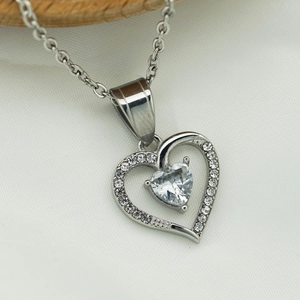 316 stainless steel necklace featuring nested heart pendants with sparkling cubic zirconia