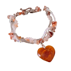 Multi-layer orange stone and glass bead necklace with a large heart pendant charm