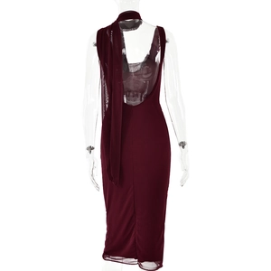 Back view of burgundy cowl neck dress featuring mesh patchwork and backless detail