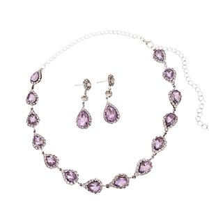 Elegant silver jewelry set featuring purple teardrop crystals and diamond floral accents