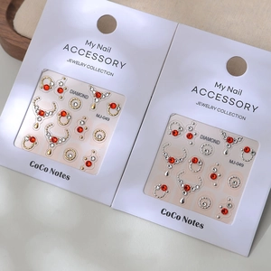 Water drop nail art charms with red rhinestones in gold and silver settings