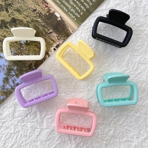 Set of six matte square claw clips in multiple colors displayed on a textured background