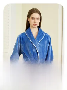 Detail of elegant shawl collar and white piping on dark blue flannel bathrobe