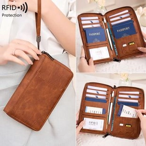 Detail view of brown leather RFID passport wallet with multi-card slots and pen holder