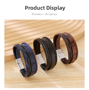 Close-up of multilayer braided leather bracelets with anchor-stamped metal magnetic clasps