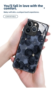 Close-up of ink flower patterns and gold foil on a sleek iPhone 16 Pro Max phone case