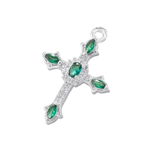 Detailed view of silver cross pendant with green oval gems and clear micro-crystals