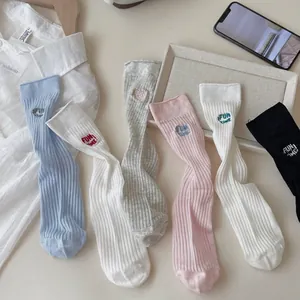 Pastel knit crew socks with FUN TIME embroidery in blue, white, gray, pink, and black