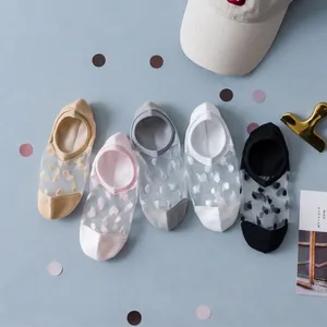 Detail of five pairs of ultra-thin sheer mesh no-show socks with elegant 3D polka dot patterns