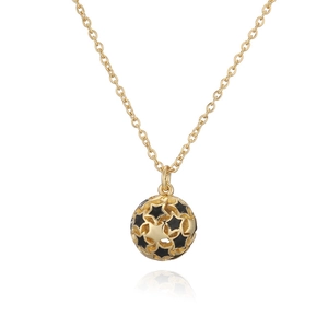 Minimalist gold star ball pendant necklace with black stars on a delicate gold chain
