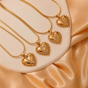 Golden heart necklaces with L-O-V-E letter pendants and pavé zircon on a snake chain